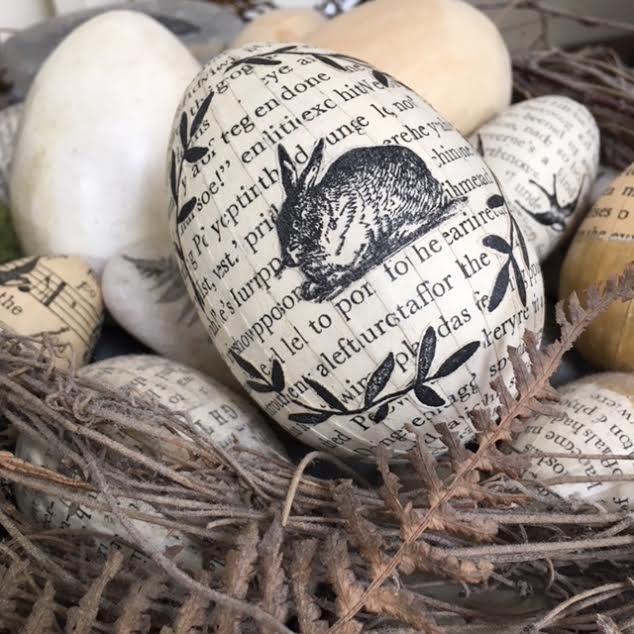 Image of Eggs covered in vintage book paper. 
