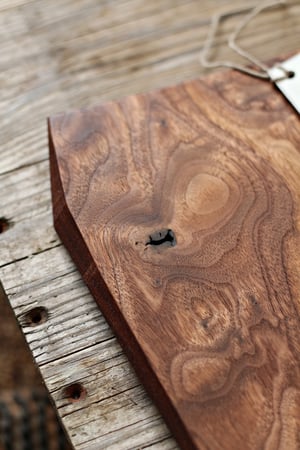 Image of Walnut serving board with natural knot and inlay