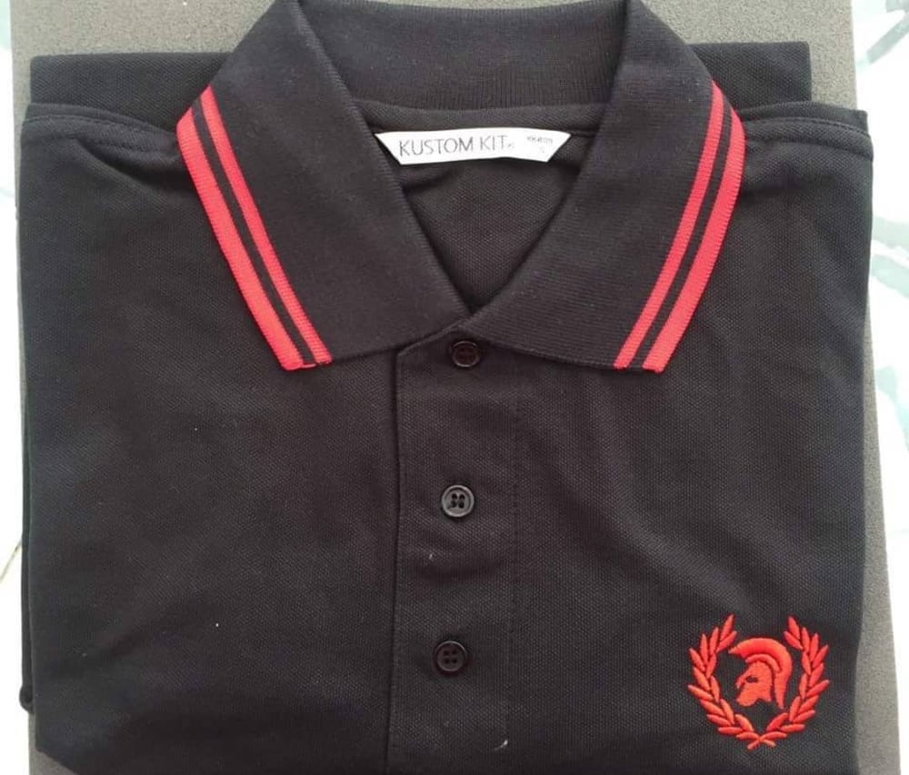 Image of Black and red trojan head in wreath