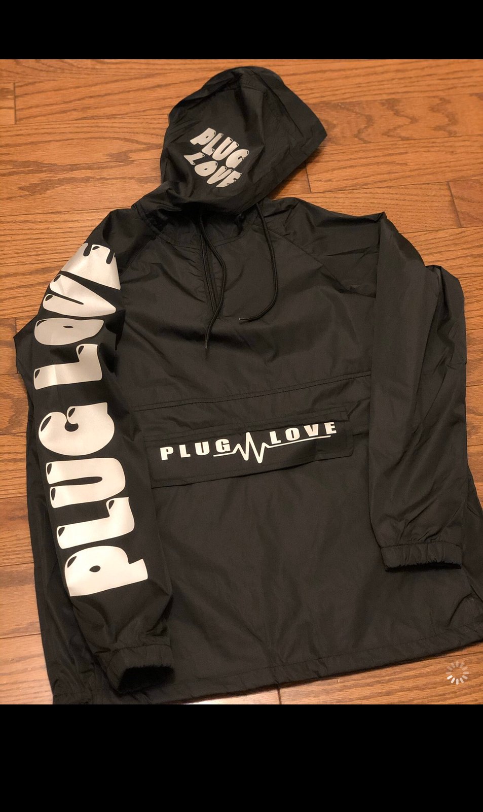 black reflective windbreaker