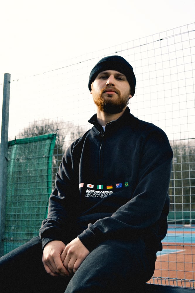 Image of ‘Worldwide’ 1/2 Zip Sweatshirt