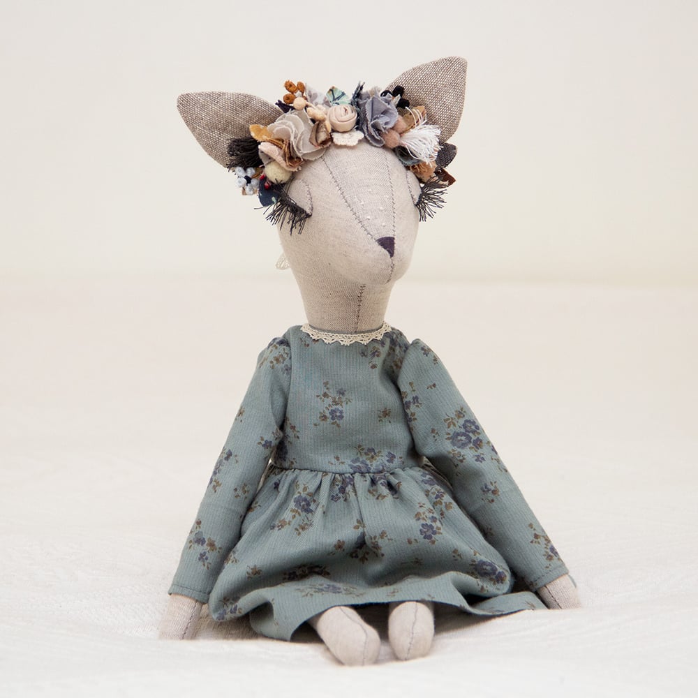 Image of Boho Deer heirloom doll with a teal floral dress
