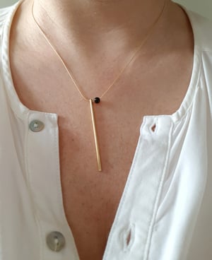 Image of Martina. Collar corto con dos encantos.