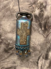 Image 1 of Cross altered bottle, blue bronze and black with beaded fringe. Night light .