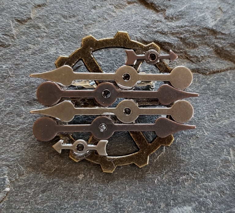Image of Mixed metals Clock hands brooch, handmade