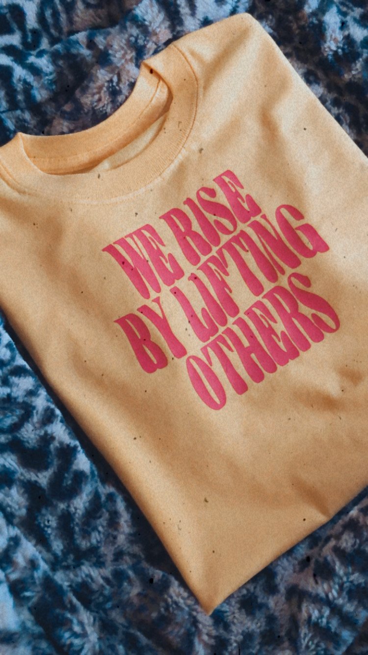 Image of We rise by lifting others tee