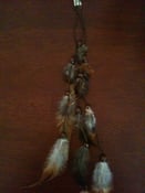Image of Tribal Chic: A Feather Hair Clip with Wooden Beads