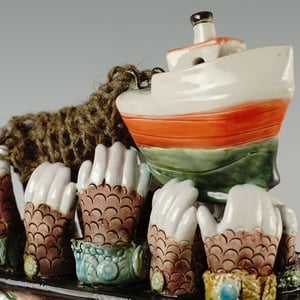 Trawler fishing boat riding the waves