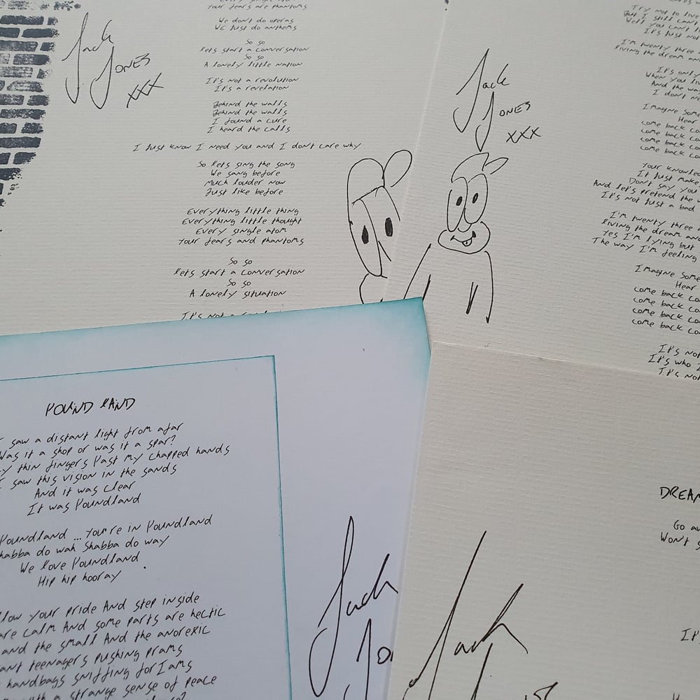 Signed lyric sheet on A4 card
