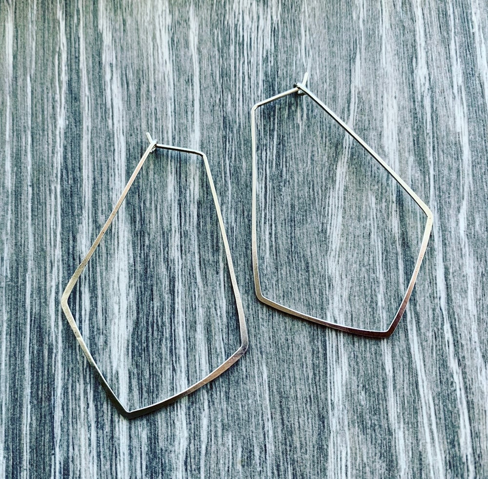 Image of Gently hammered, solid silver wire earrings.