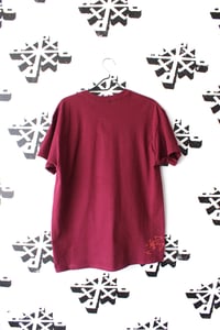 Image of plotting on the fall tee in maroon 