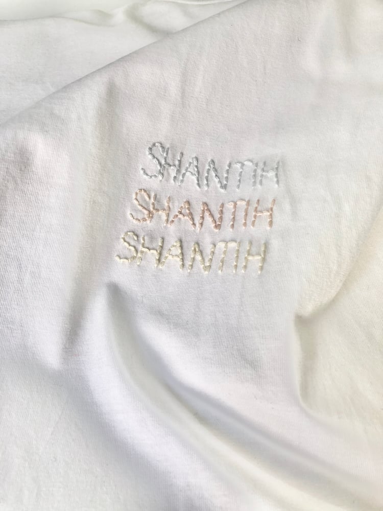 Image of SHANTIH SHANTIH SHANTIH – pastel colors – white classic t-shirt