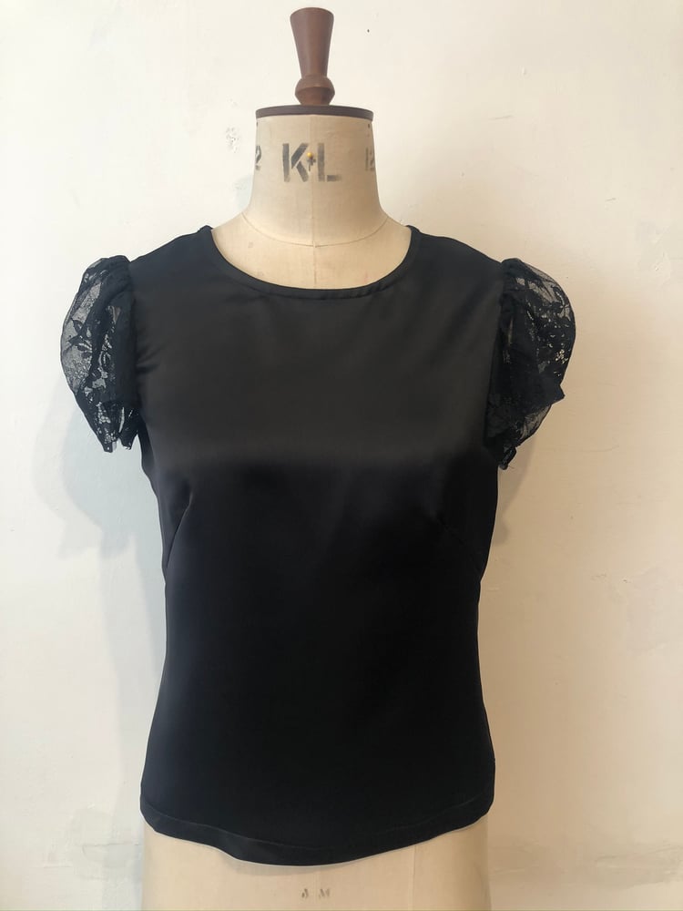 Image of Lace back ruffle top