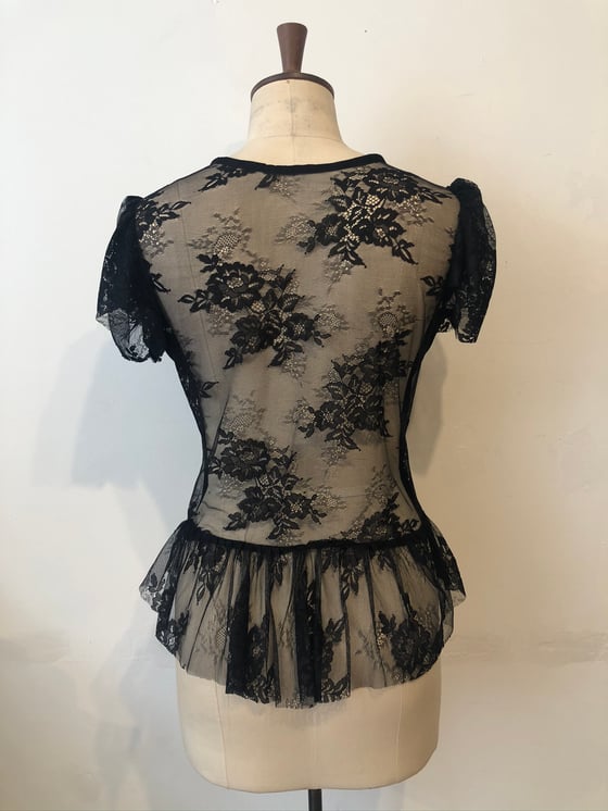 Image of Lace back ruffle top