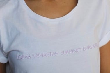 Image of LOKAH SAMASTAH SUKHINO BHAVANTU – lilac – white t-shirt w/ rolled-up sleeves