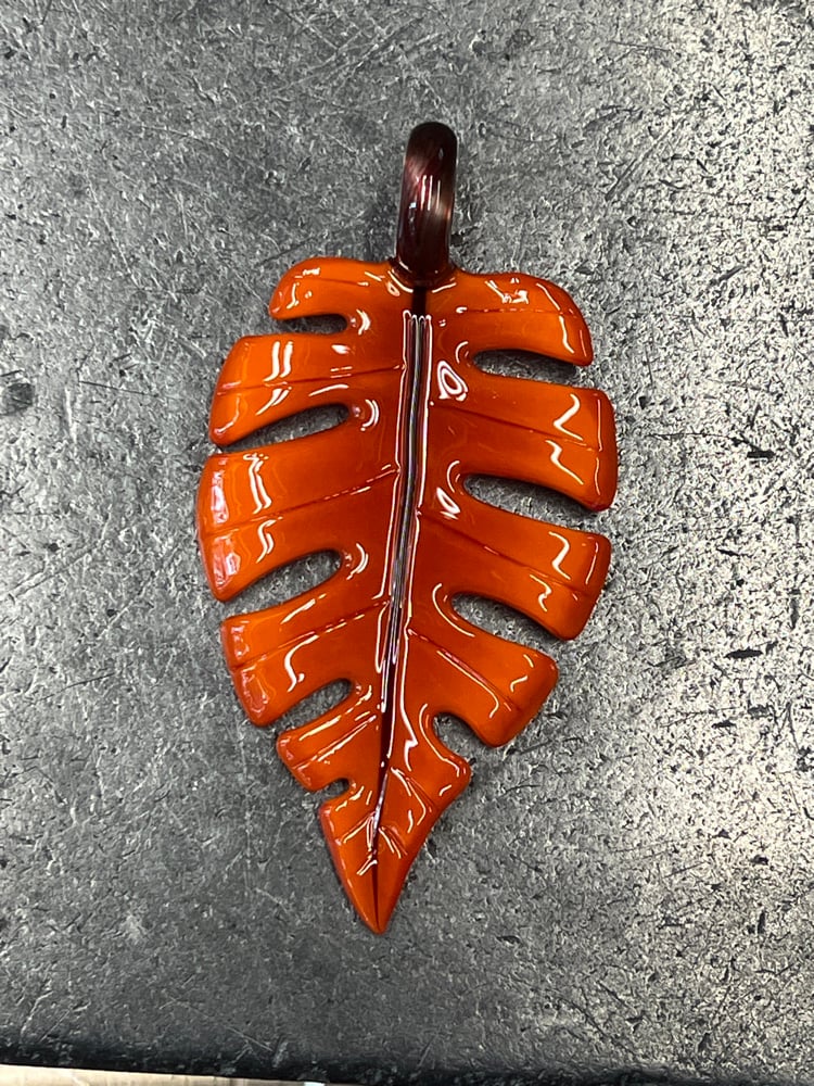 Image of Orange Sunburst Monstera Leaf Pendant