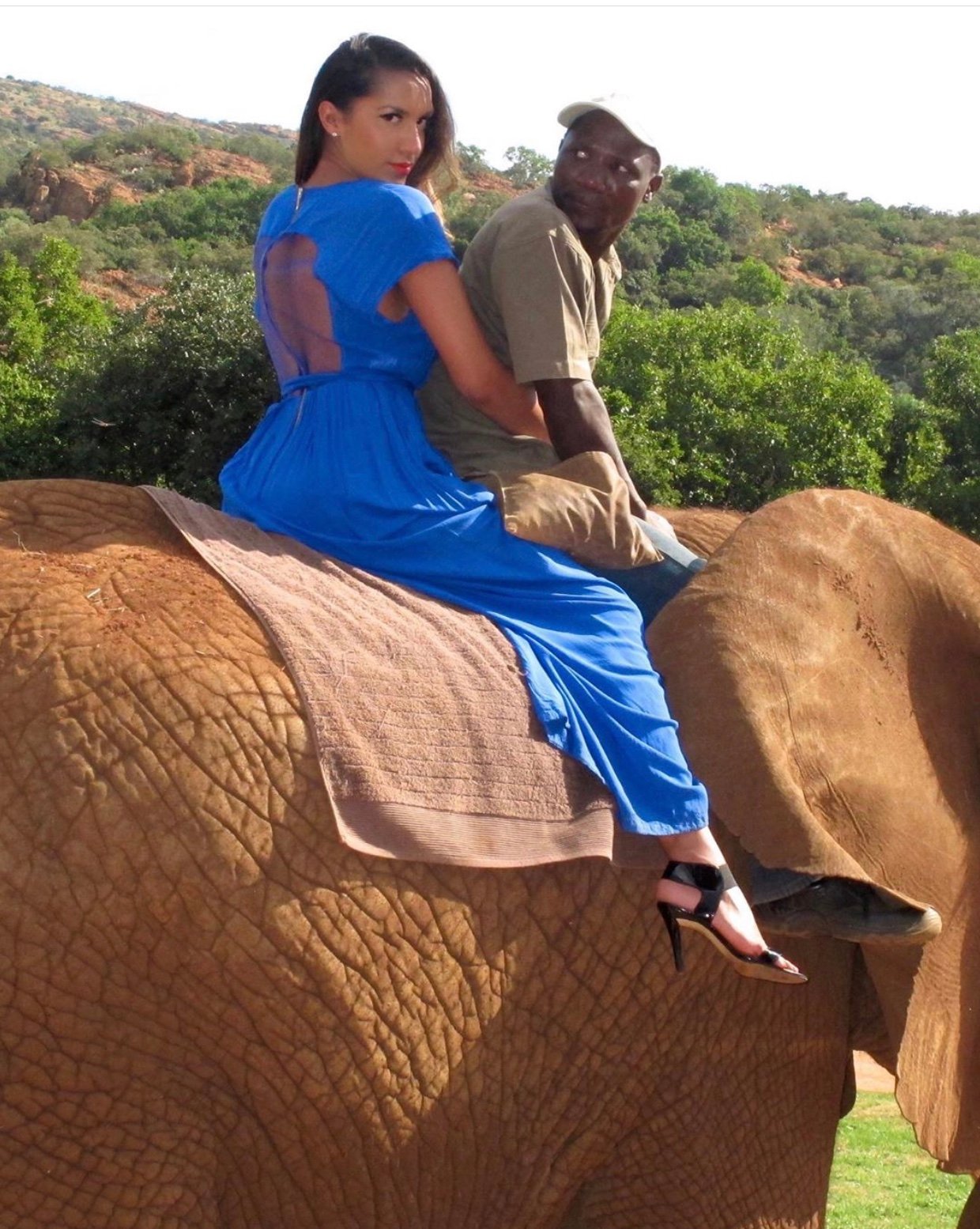 Image of BLUE FLARED-LEG JUMPSUIT WITH SHEER BACK CUTOUT (EU 34)