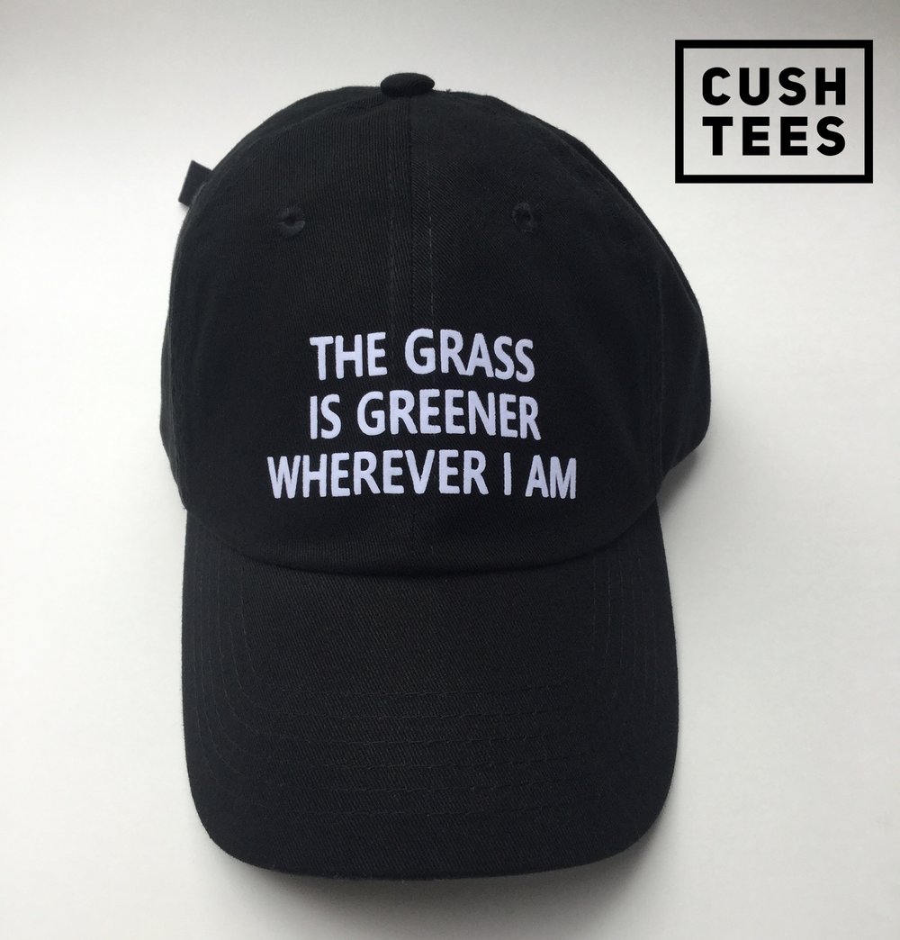 The grass is greener wherever I am. (Dad Hat)