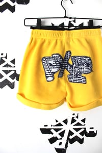 Image of top notch shorts in yellow 