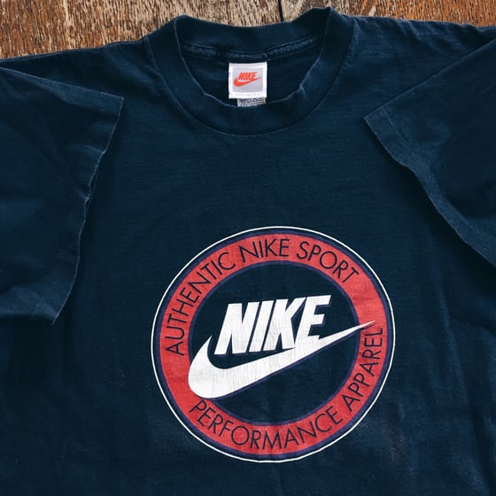 Image of Original Early 90’s Nike “Performance Apparel” Branding Tee.