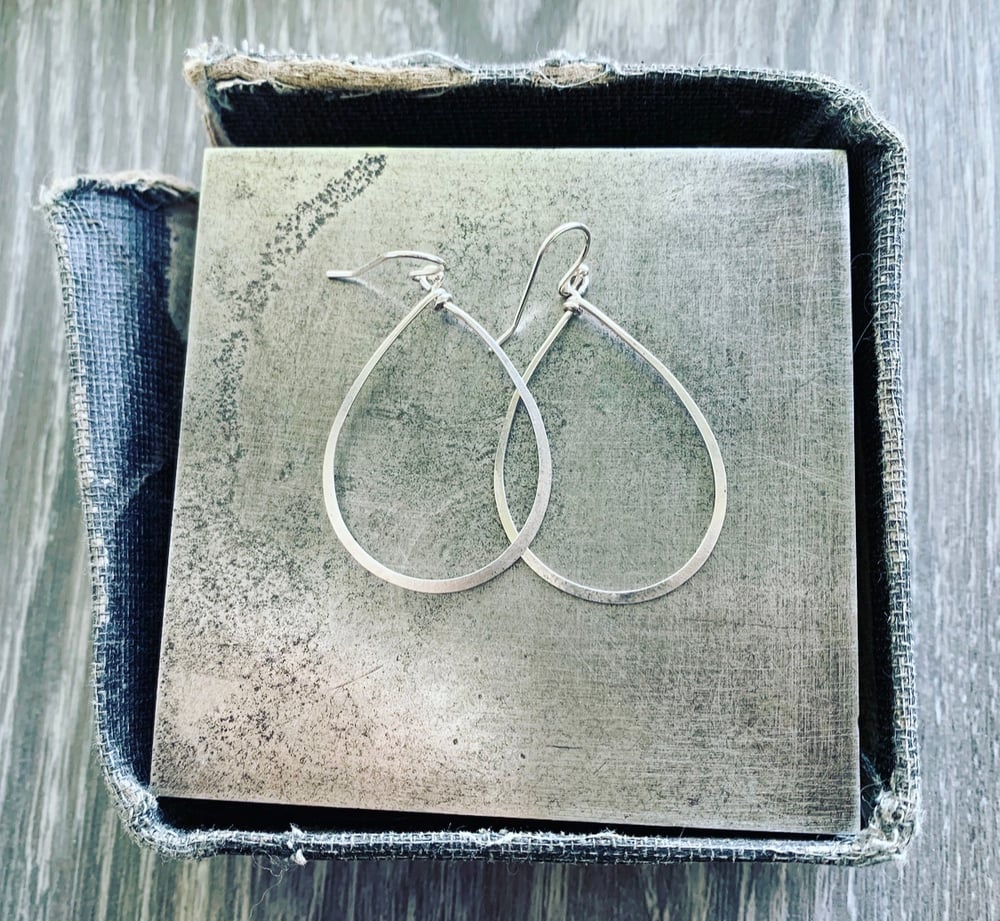 Image of Gently hammered, solid silver wire earrings.