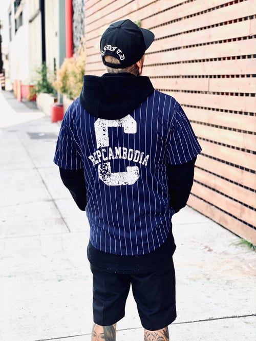 Image of NAVY BLUE PIN STRIPED VINTAGE ARCH BASEBALL JERSEY