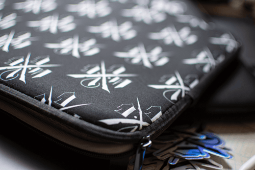 Image of DCWC LAPTOP SLEEVE - LOGO REPEAT