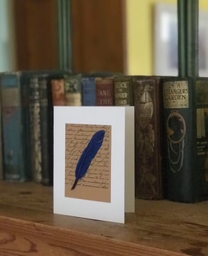 Image of Feather and Script 