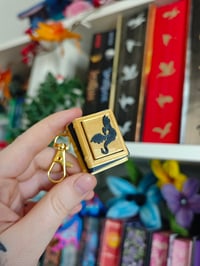 Image 1 of Llavero clicker libros dragón 