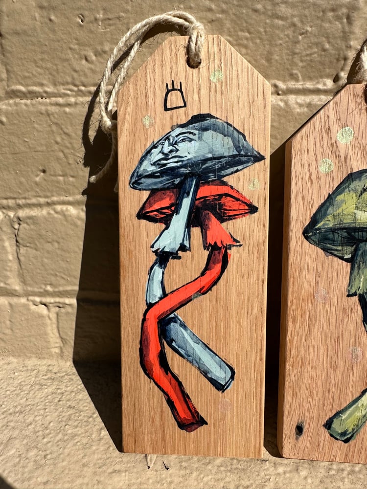 Image of Orange and blue mushrooms tag