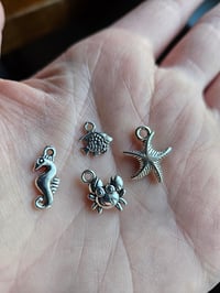 Image 4 of lagoon teal seaglass wine charms