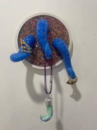 Image 1 of Triple blue tentacles on white wound base with sprinkles