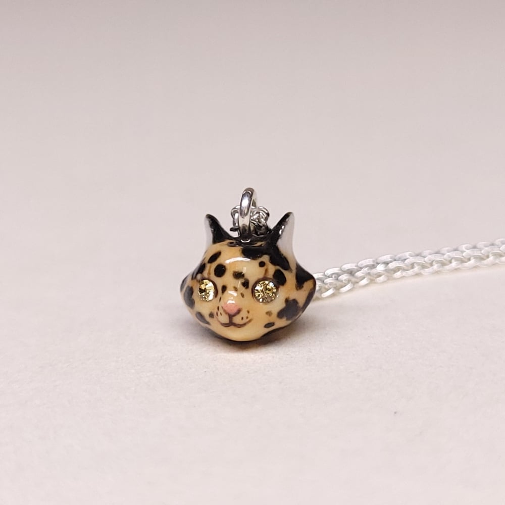 Image of Tortoiseshell Porcelain & Sterling Silver Teeny Tiny Cat Pendant