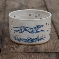 Image 1 of Stoneware votive candle holder featuring Hare and hound 