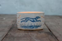 Image 3 of Stoneware votive candle holder featuring Hare and hound 