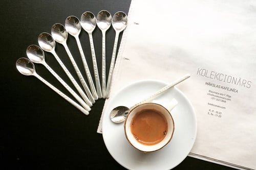 Image of small silver spoon with inscription in Latin