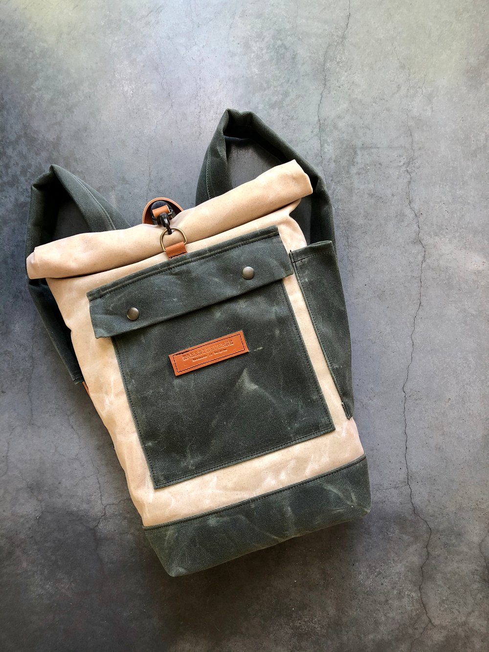 Image of Natural and olive green waterproof waxed canvas backpack medium size with padded shoulder straps