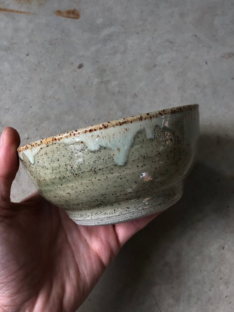 Image of footed speckled bowl in sage