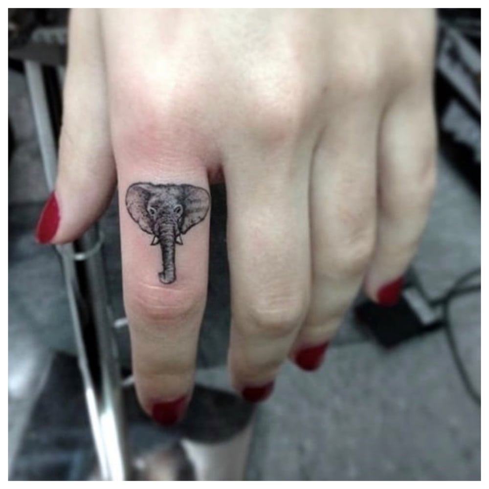 T.O.T finger tats