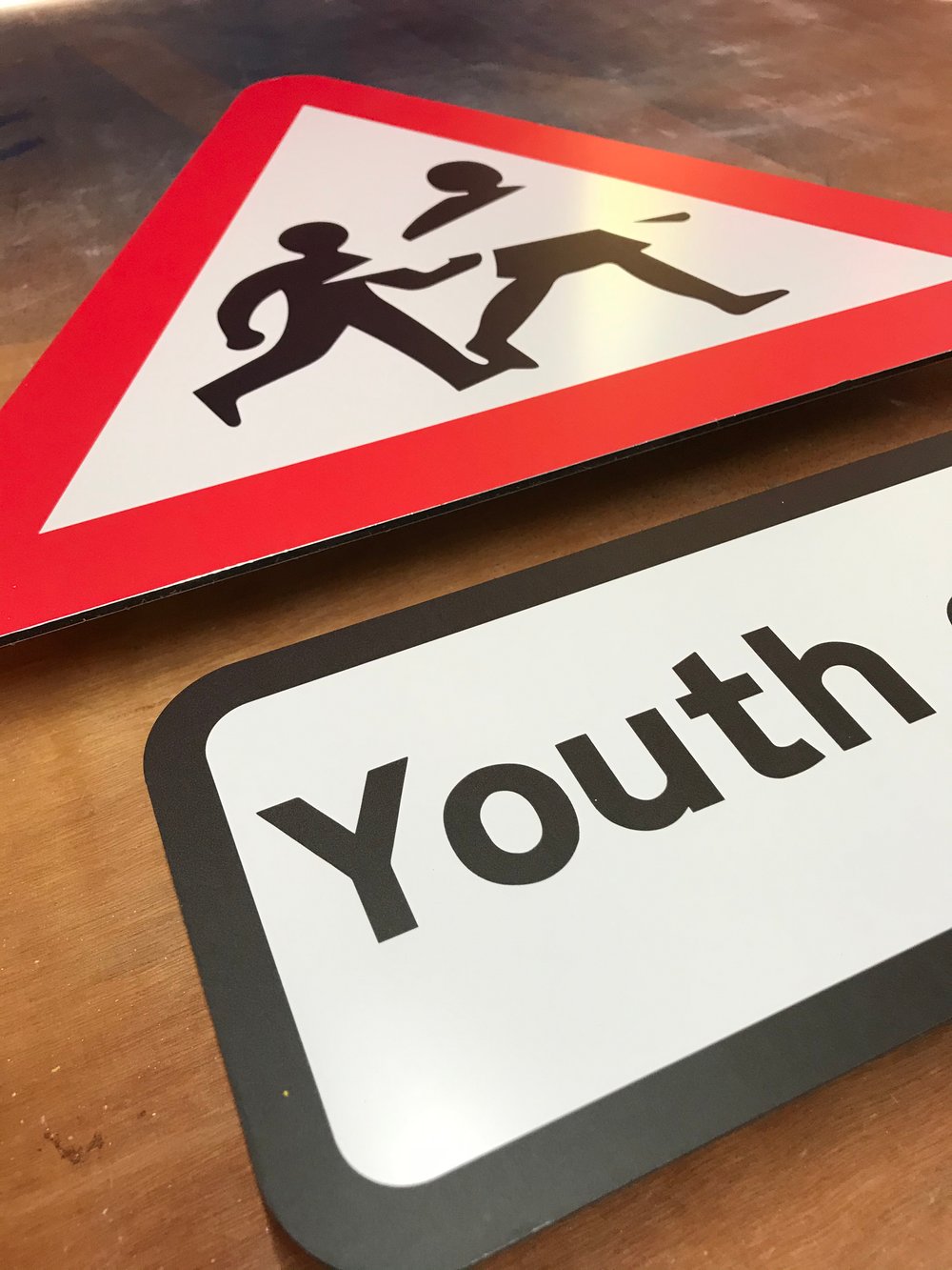 Image of Youth Cuts Metal Road Sign