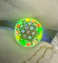 Image 1 of Transparent black with an orange core UV