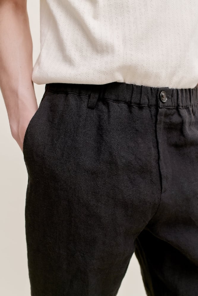 Image of A KIND OF GUISE ELASTICATED WIDE TROUSERS MYSTIC BLACK