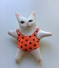 Tiny swimmer cat/starfish pin