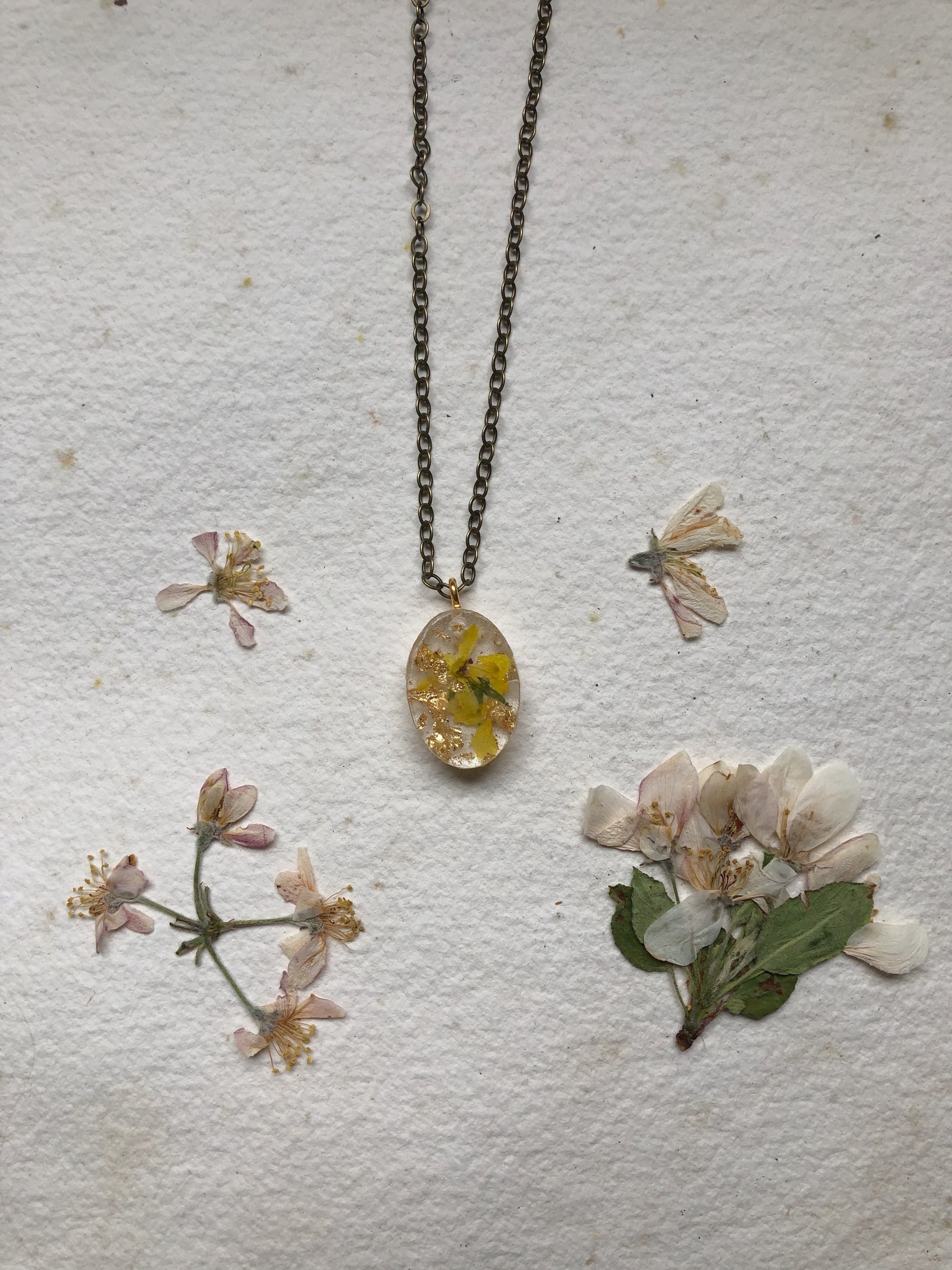 Image of petite yellow + gold leaf oval pendant