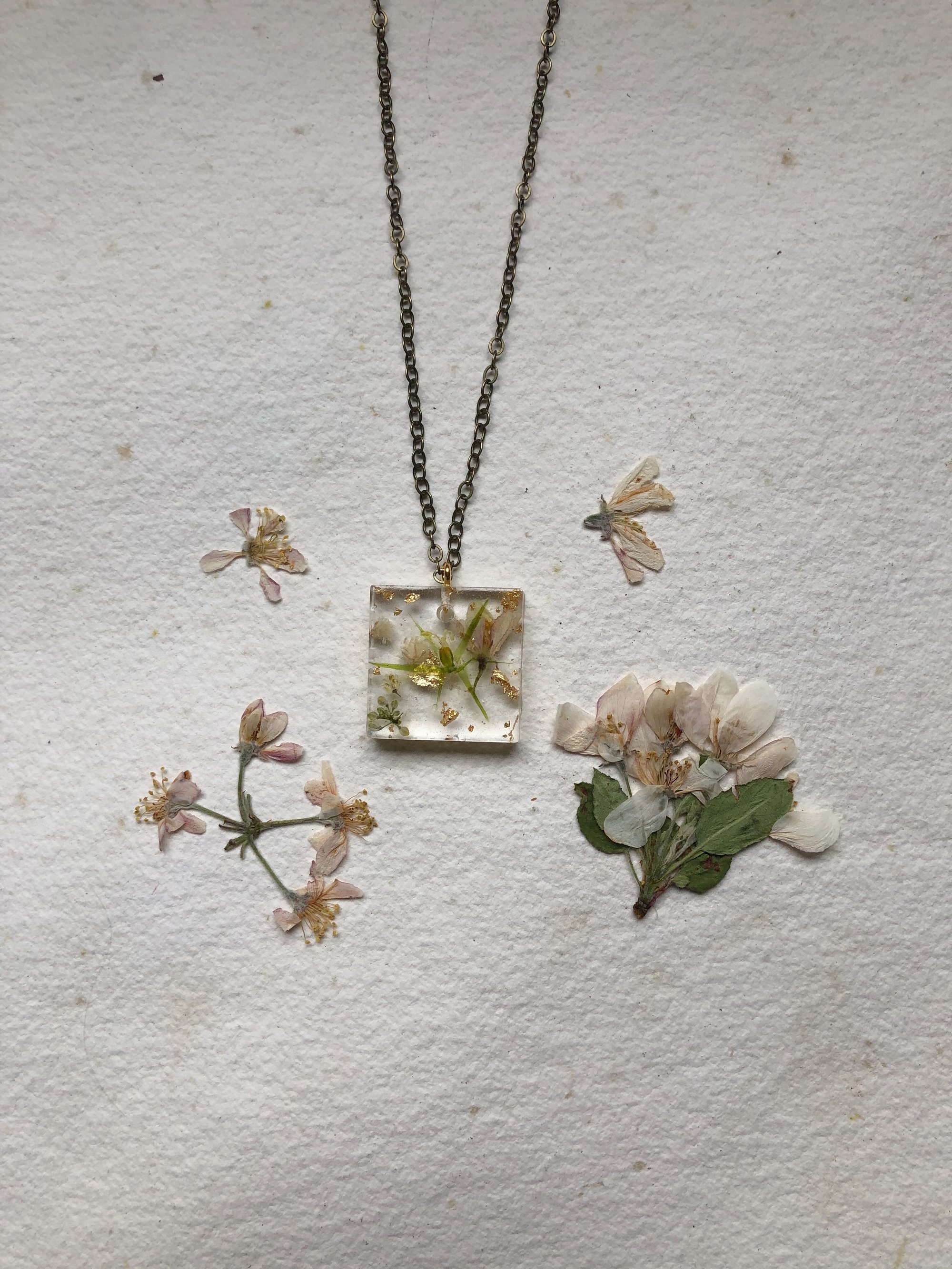 Image of dainty white + gold leaf square pendant