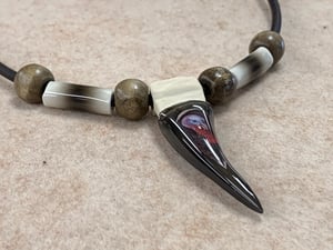 Image of Replica Turkey spur necklace with a Melissa ball gobbler head logo