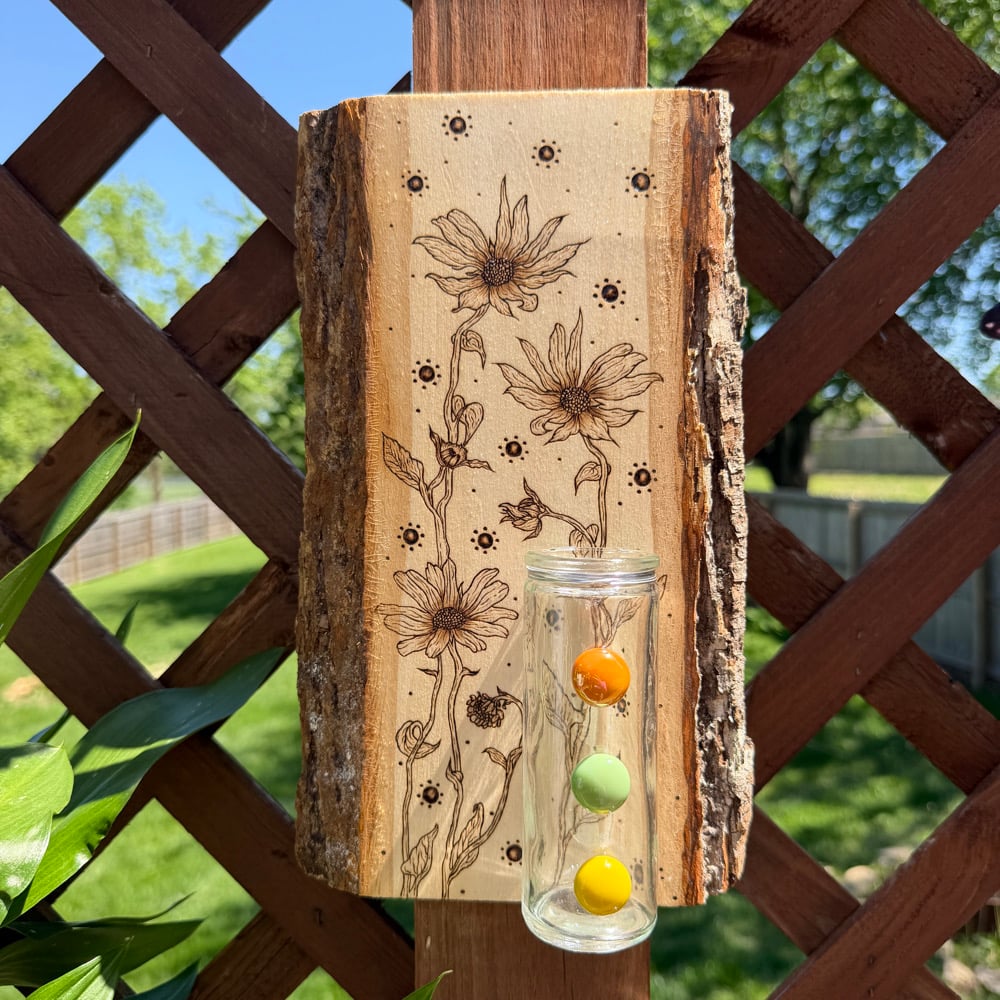 Image of sun seeker propagation station wood art