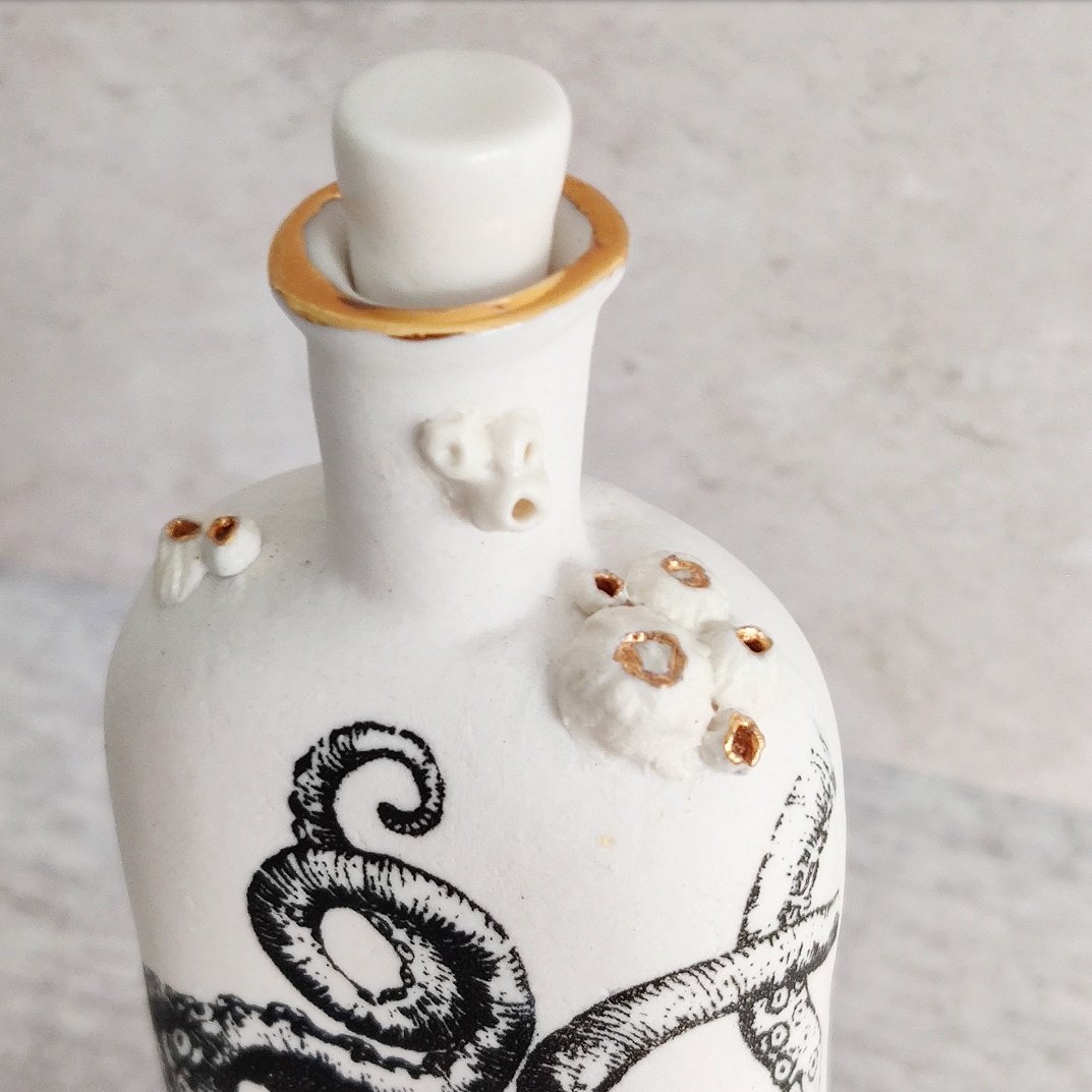 Porcelain 'boots' octopus bottle with barnacles