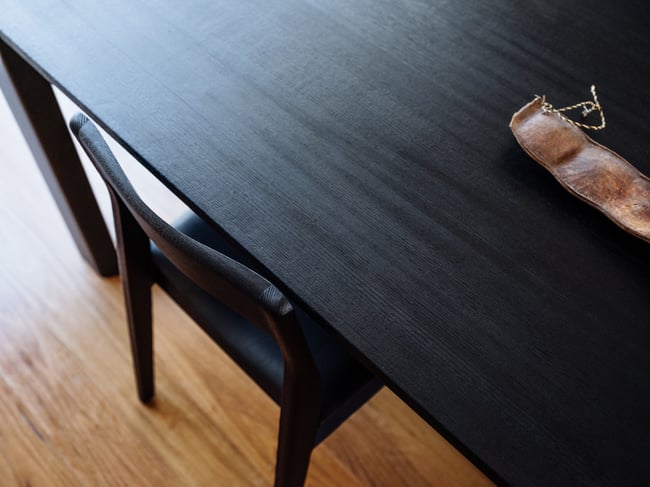 ROSE DINING CHAIR IN TORCHED TASMANIAN OAK WITH AN UPHOLSTERED LEATHER SEAT