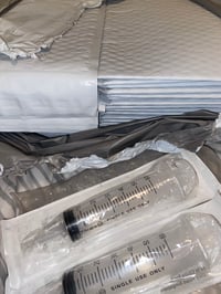 Bubble mailers, 2 syringes, and pipettes 